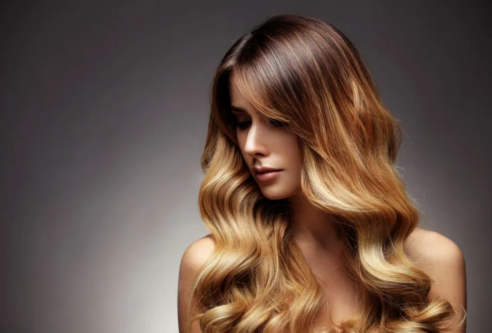 Long honey balayage waves catching the light