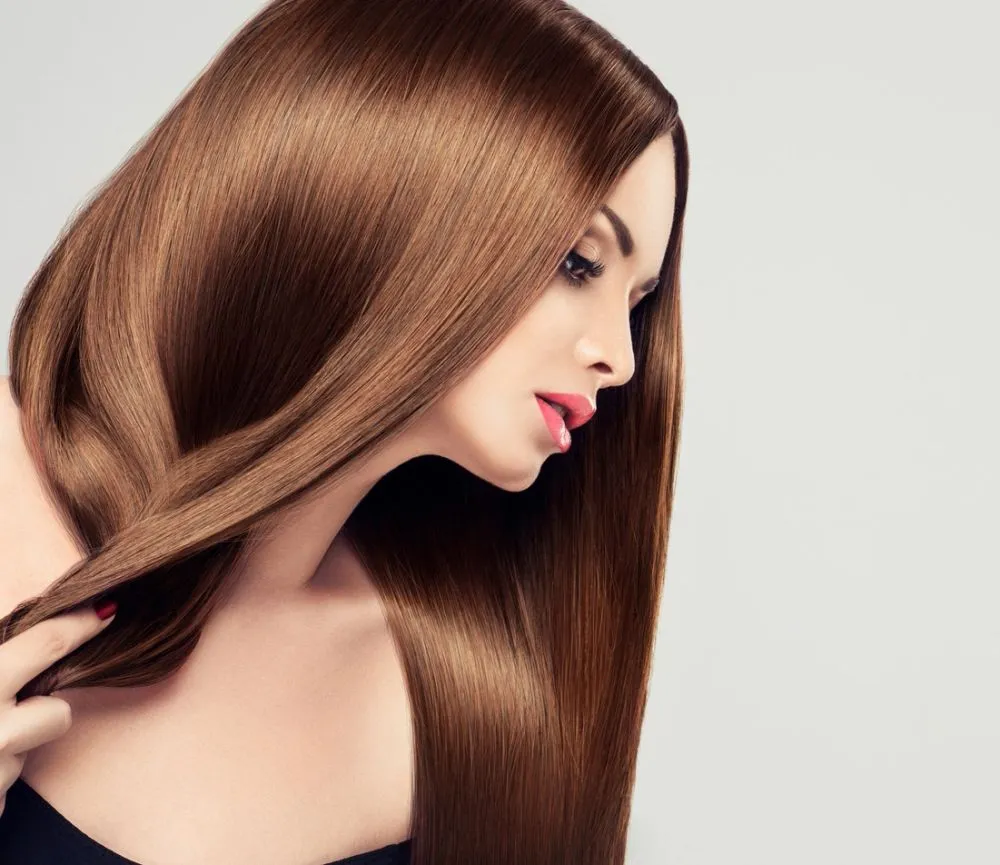Long, sleek copper-brown hair with a mirror shine